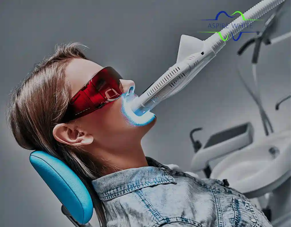 Patient relaxing in clinic chair during 1 hour laser teeth whitening session Stockport
